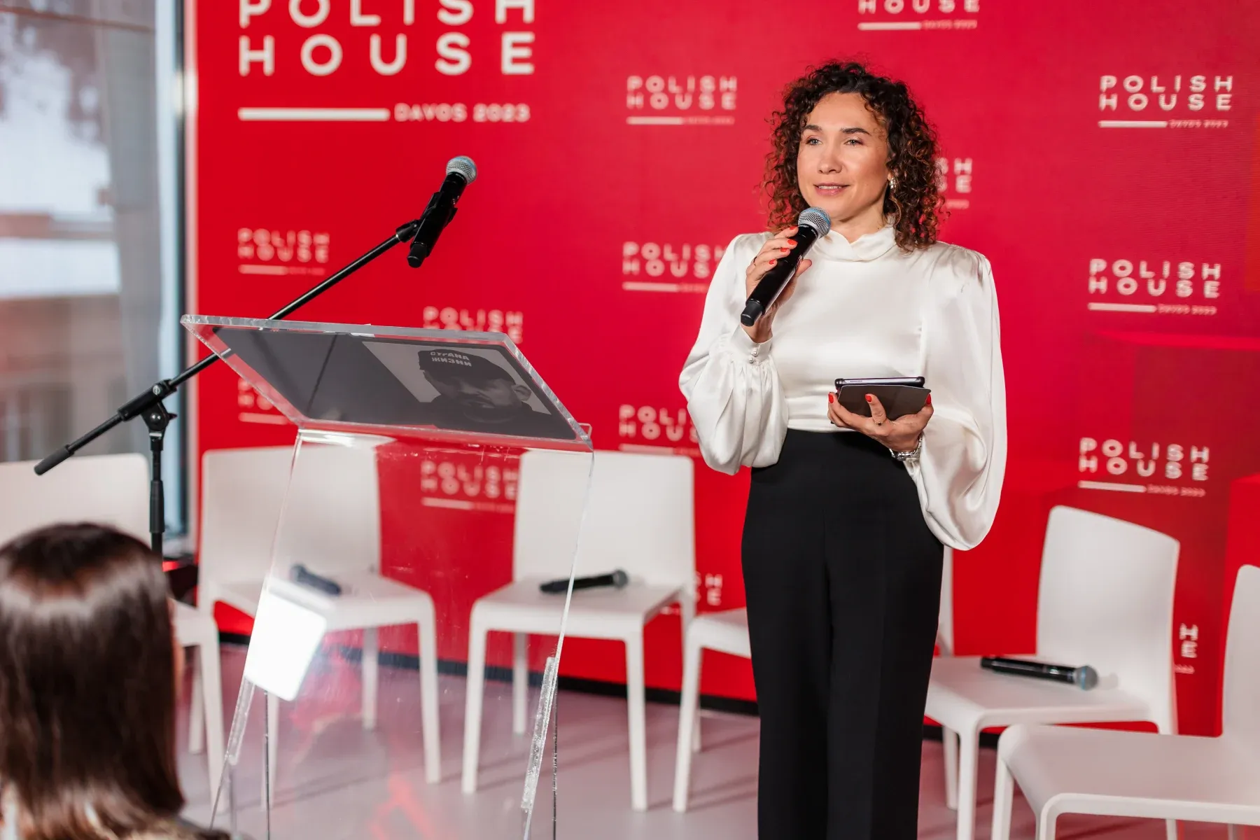 Magdalena Petryniak speaking at the Polish House podium during the World Economic Forum in Davos